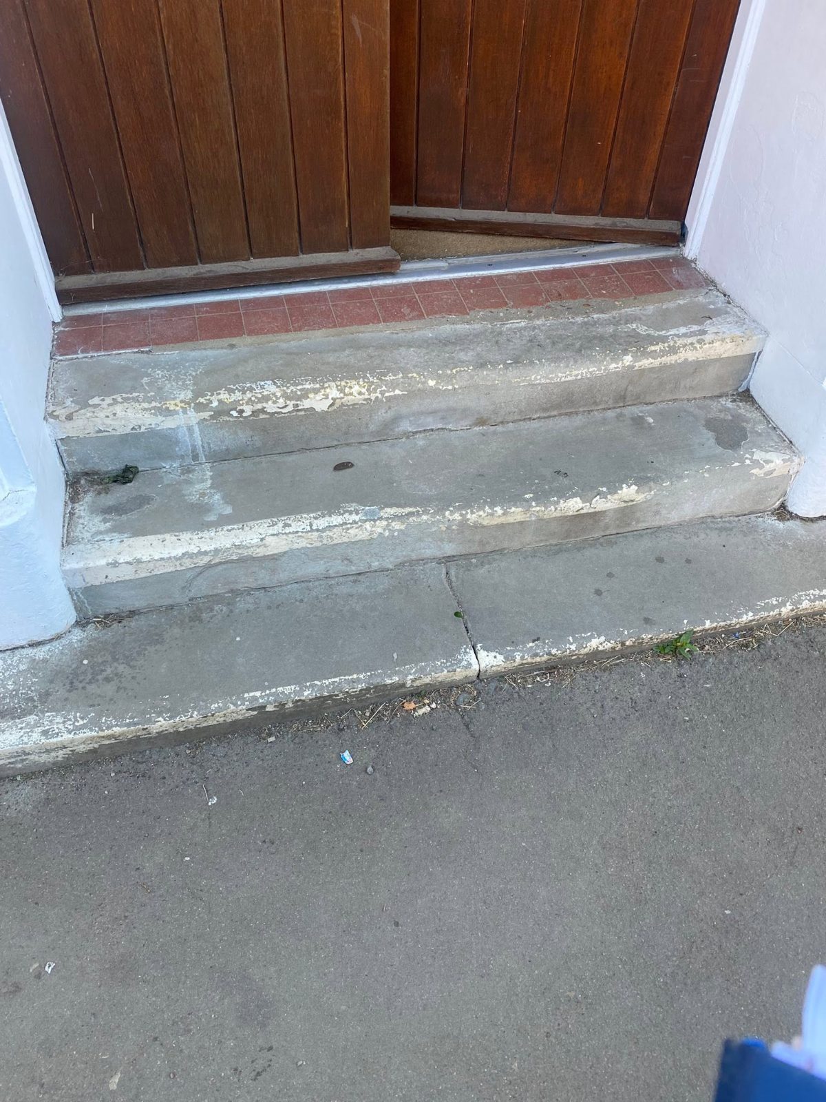 Crumbling painted concrete doorstep
