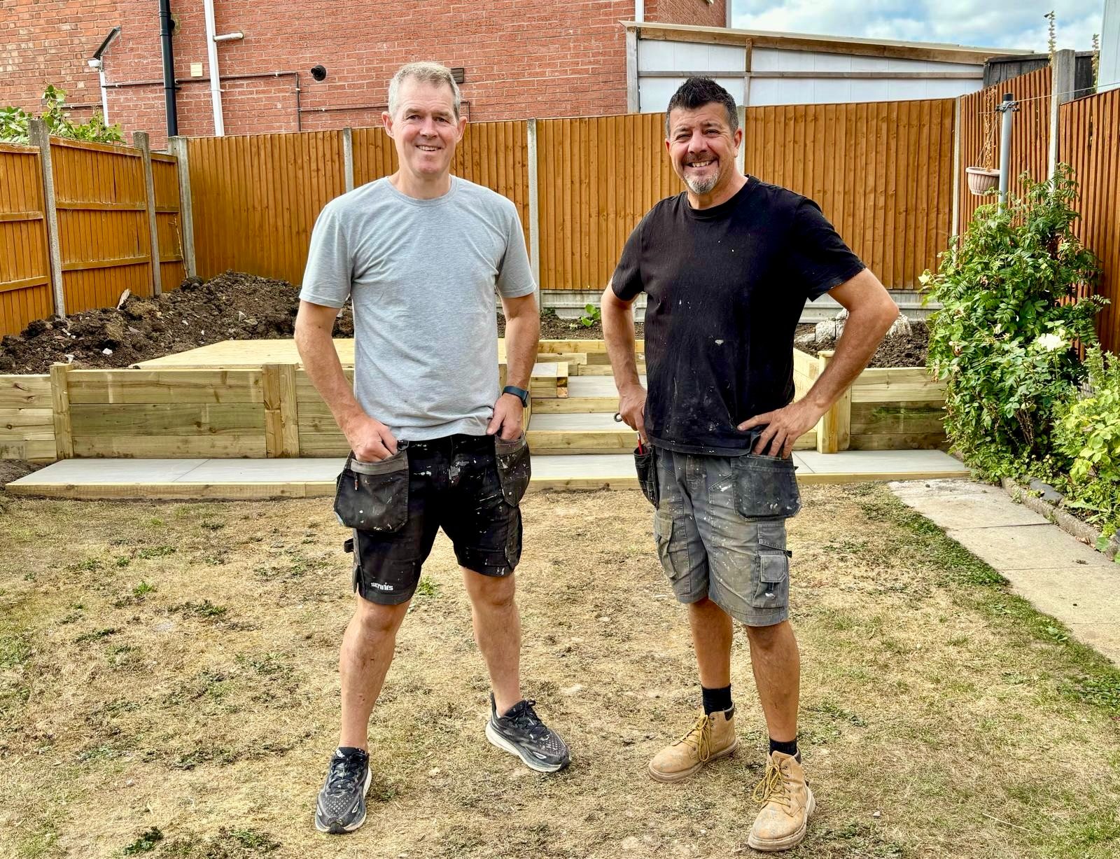Dave and Richard standing in front of a newly built sleeper platform